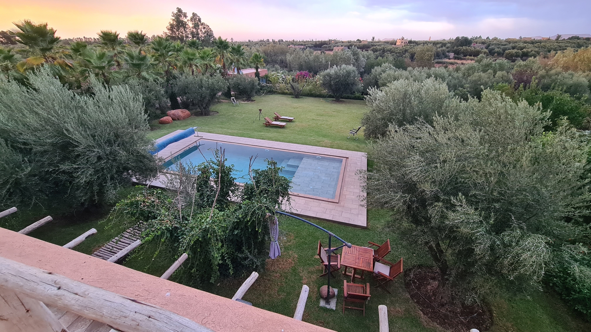 Exclusive villa rental in Morocco surrounded by terracotta tones, palm gardens and desert silence