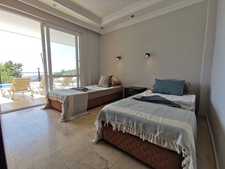 Bedroom 4 with patio doors leading to your pool