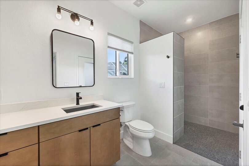 Guest bathroom featuring large walk-in shower