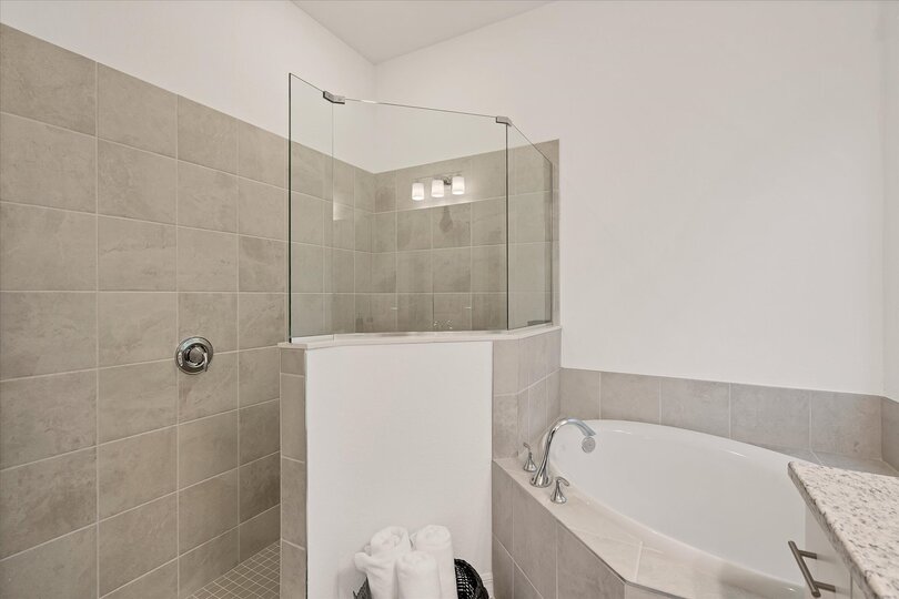 Ensuite features a walk-in shower, soaking tub and double vanities