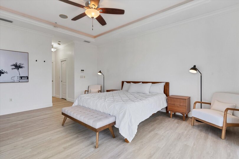 Primary Bedroom features king bed, ensuite, and lanai access