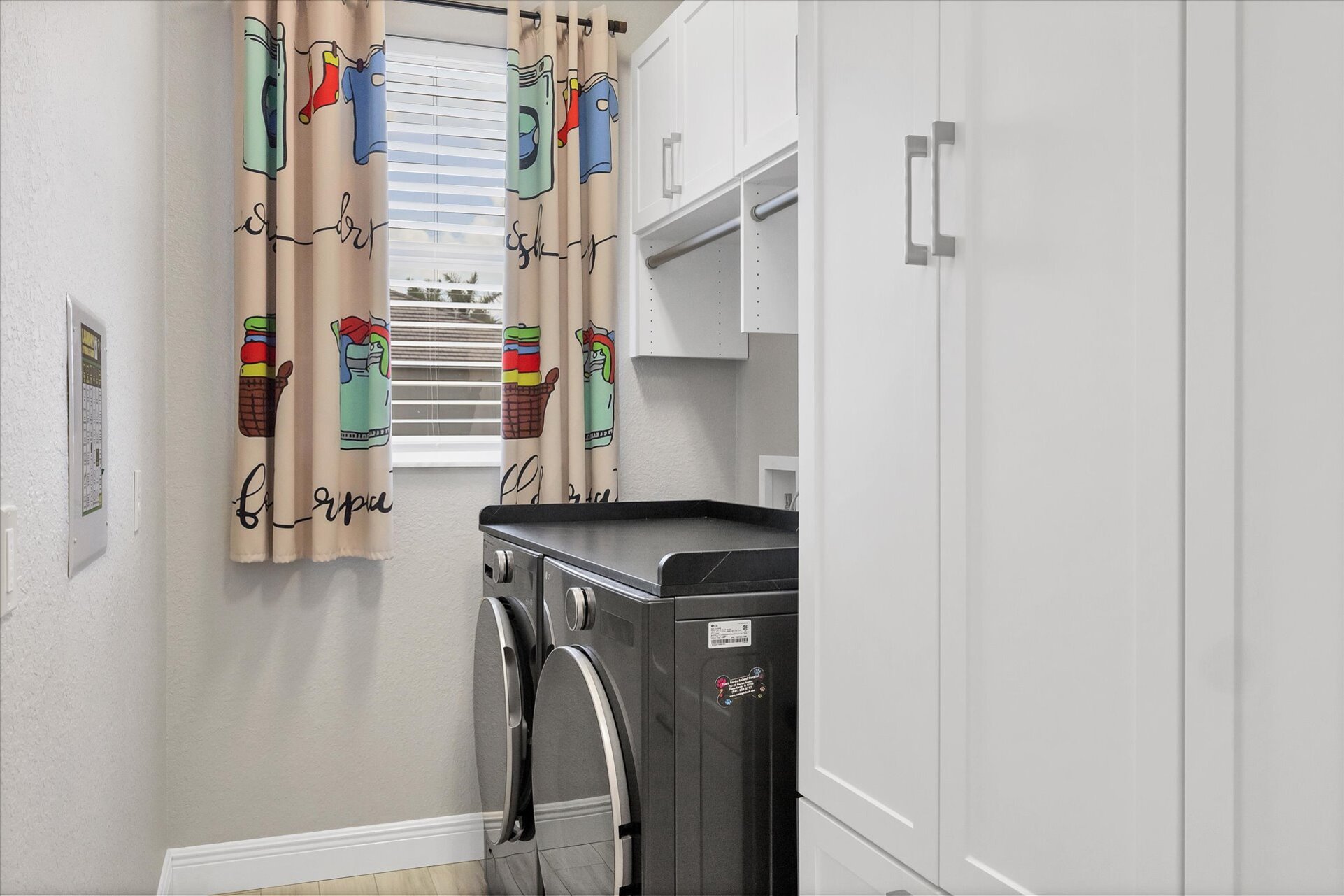 Laundry room with full-size washer & dryer