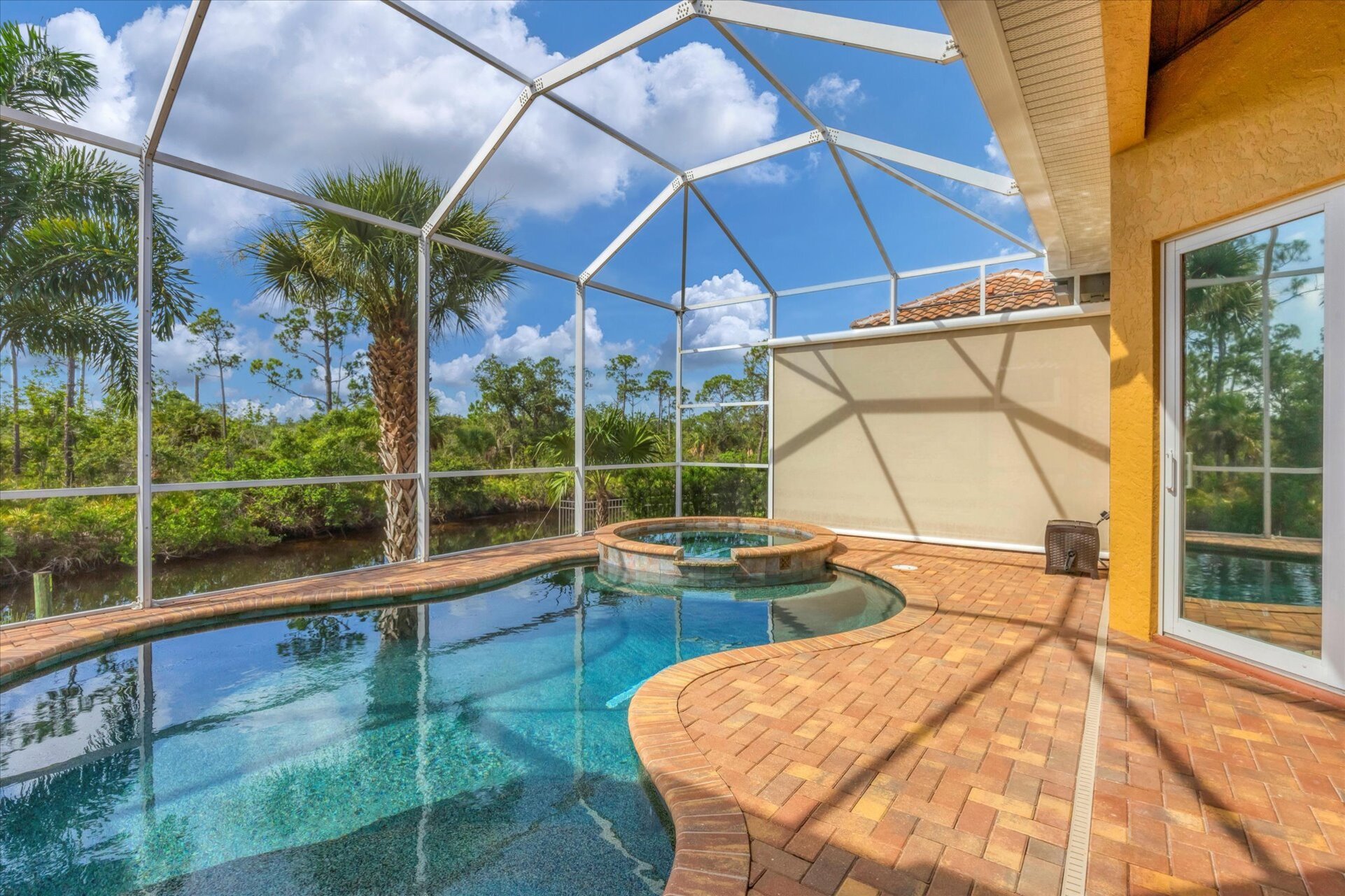 Sparkling private saltwater pool & spa overlooking water. Lanai features remote controlled privacy screens. Pool size is 17'L x 10'W x 6'D