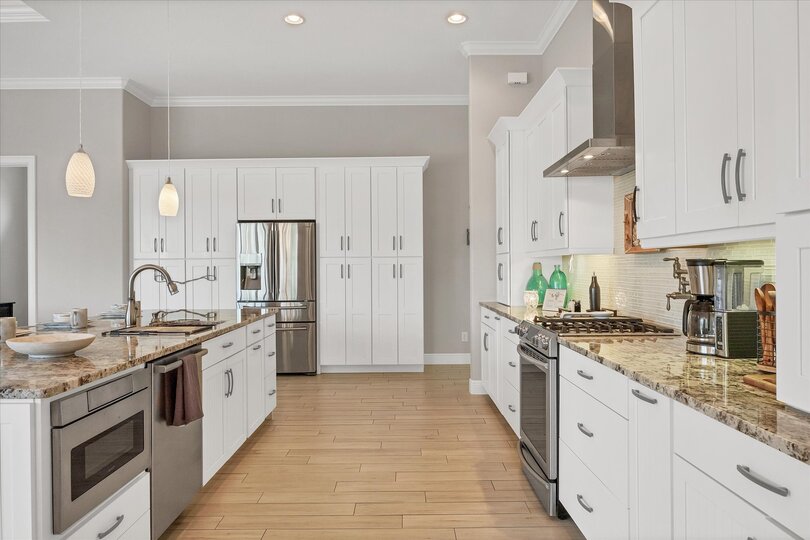 Gorgeous, bright, fully-equipped kitchen with stainless steel appliances, gas range, and plenty of storage & countertop space. Kitchen island seats 6