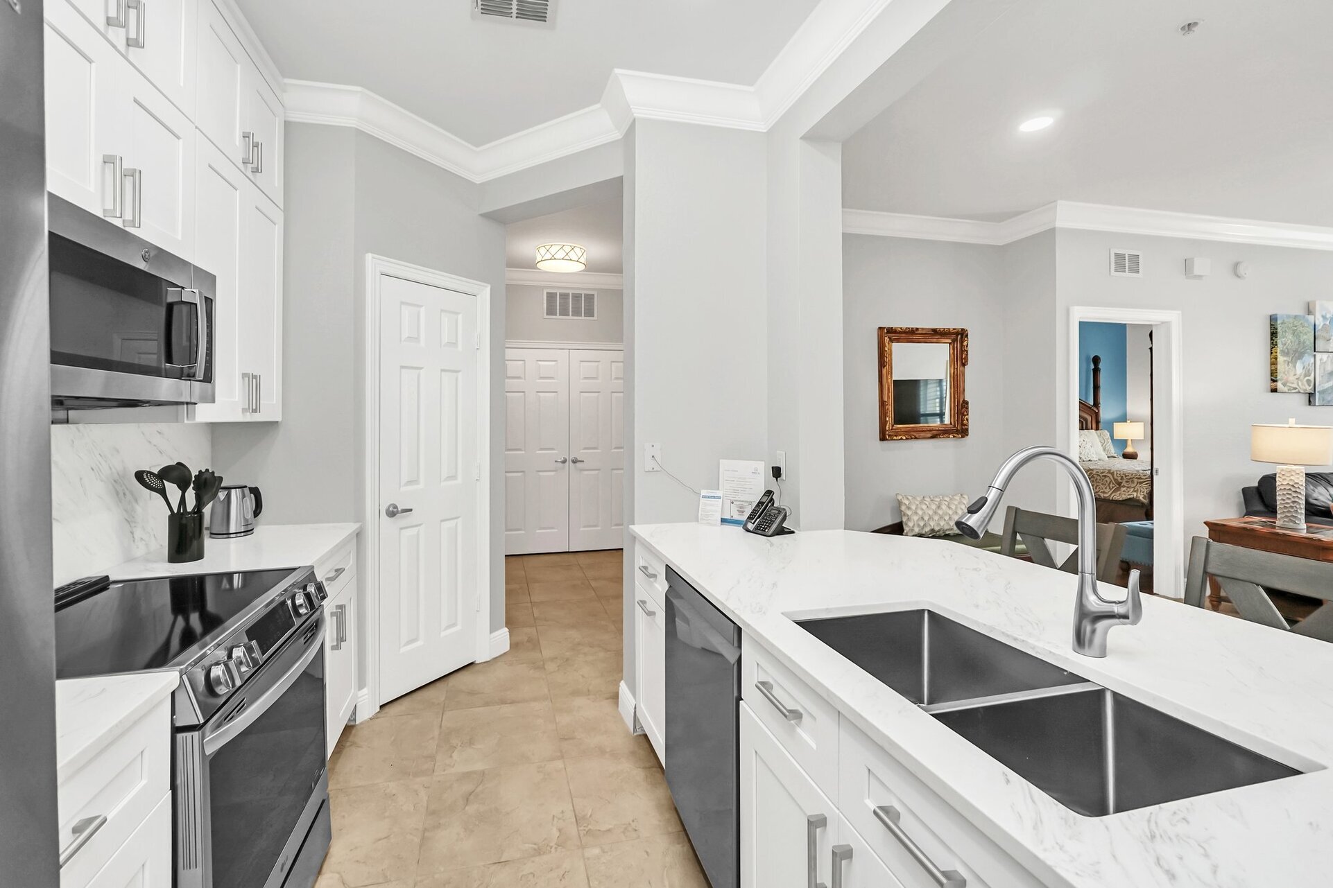 The kitchen features upgraded appliances and granite countertops