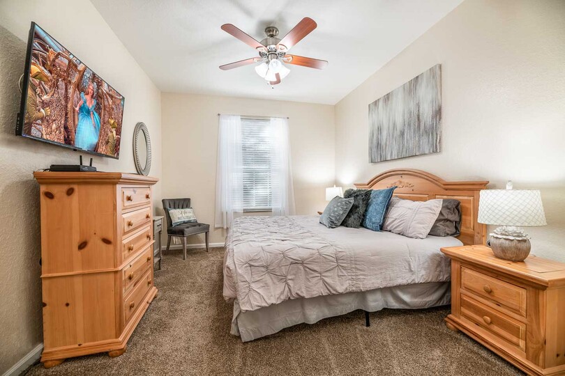 This spacious bedroom offers a king-sized bed