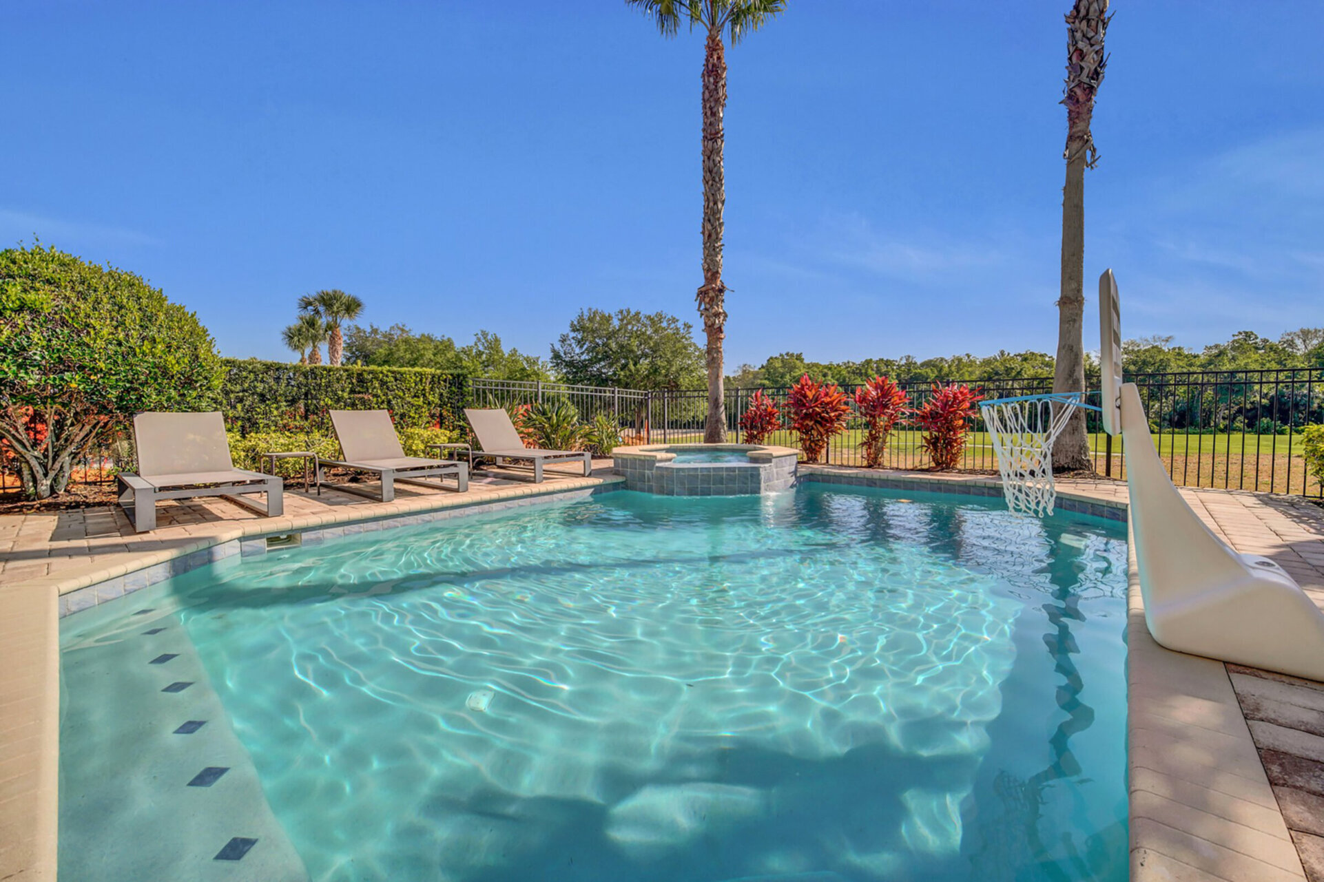 Relax on one of the poolside loungers