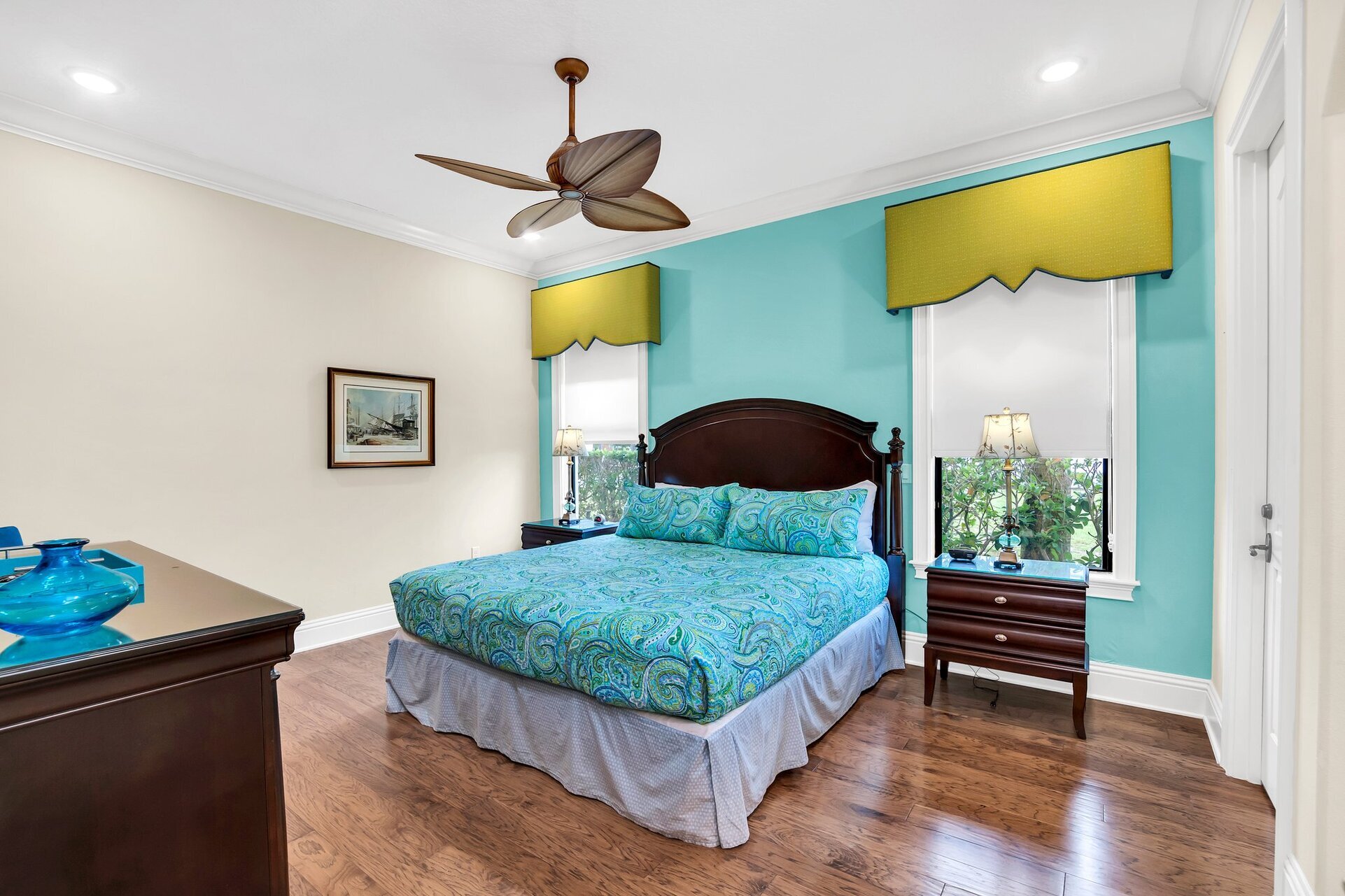 Enjoy this colorful second master bedroom with a King size bed