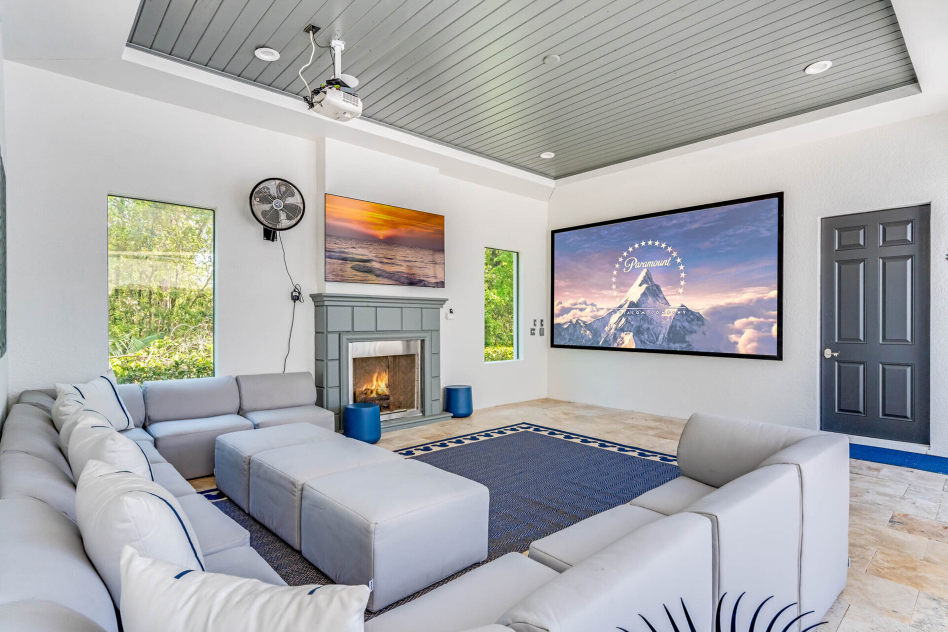 Outdoor SMART projector and comfortable lounge seating with cable and PS5 for entertainment