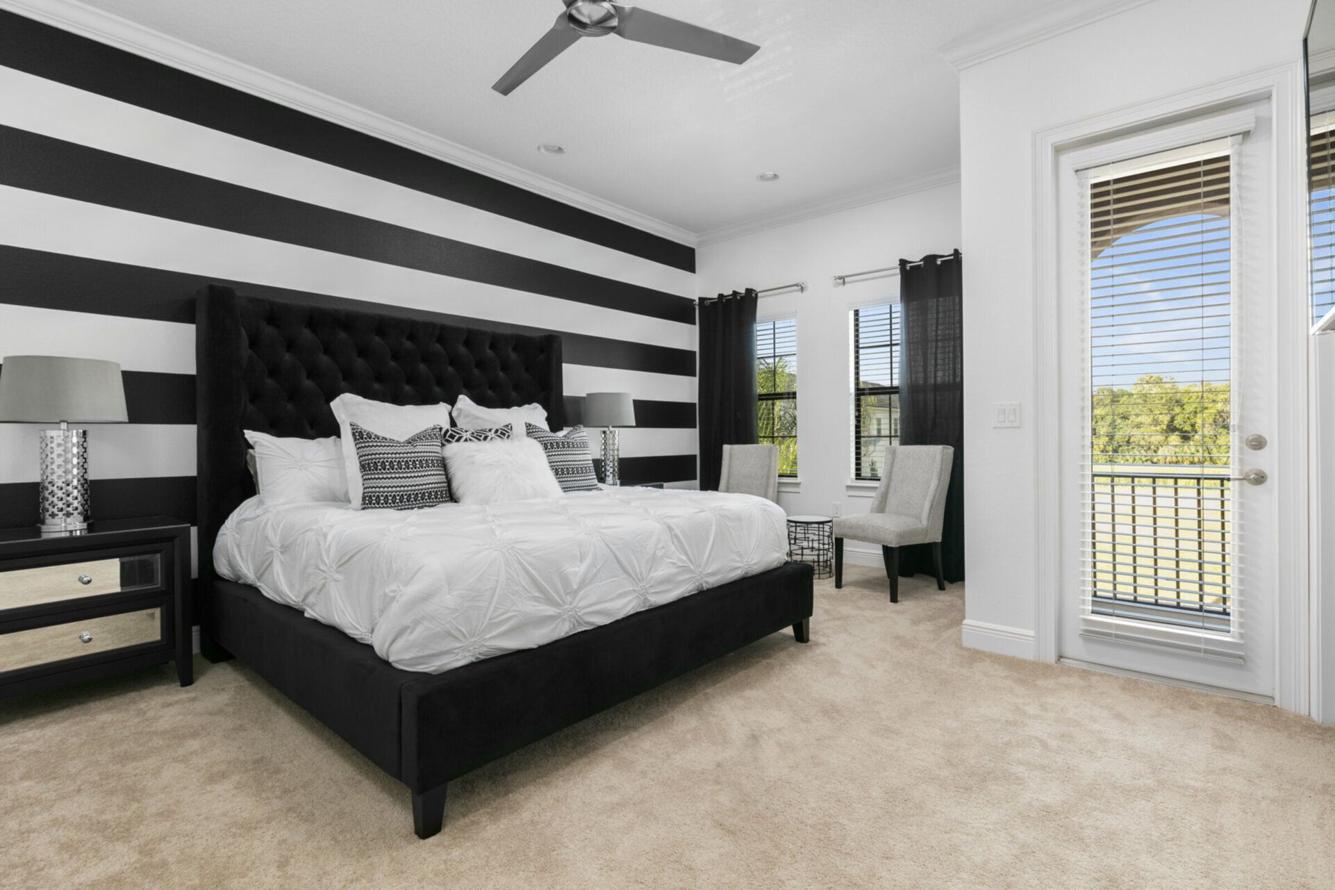 This second floor bedroom has another king bed and balcony access