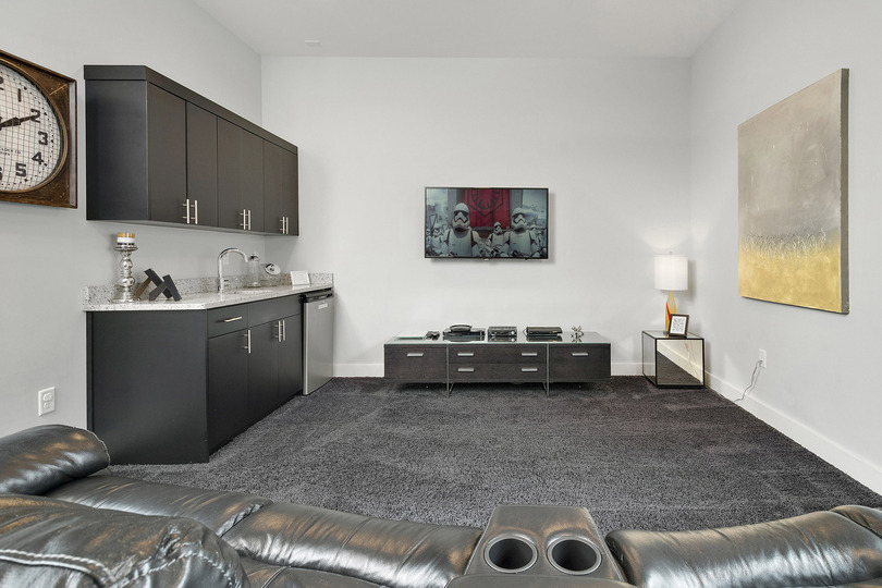 The games room features a 50-inch TV, PlayStation 3, Wet bar, and 60-in-1 multi-arcade machine