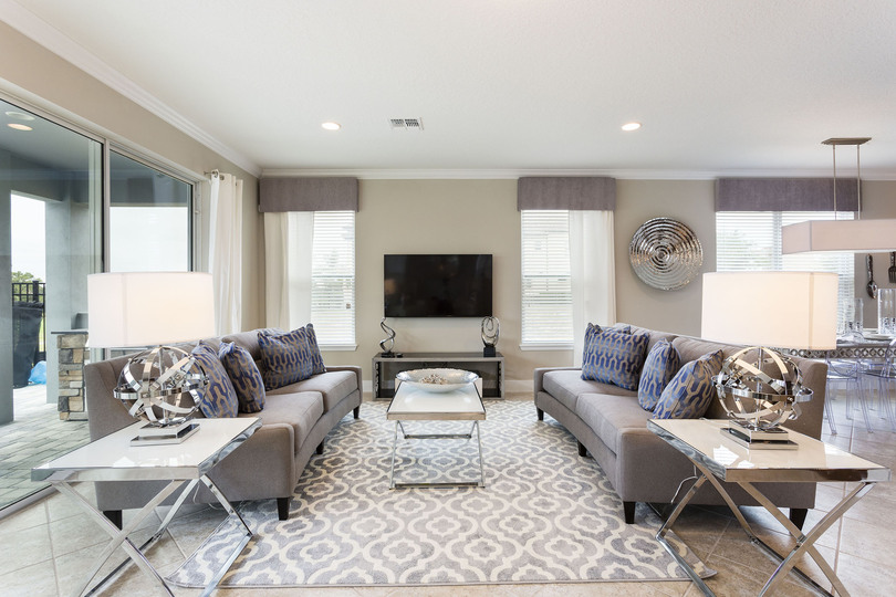 The living area features a 60-inch SMART TV