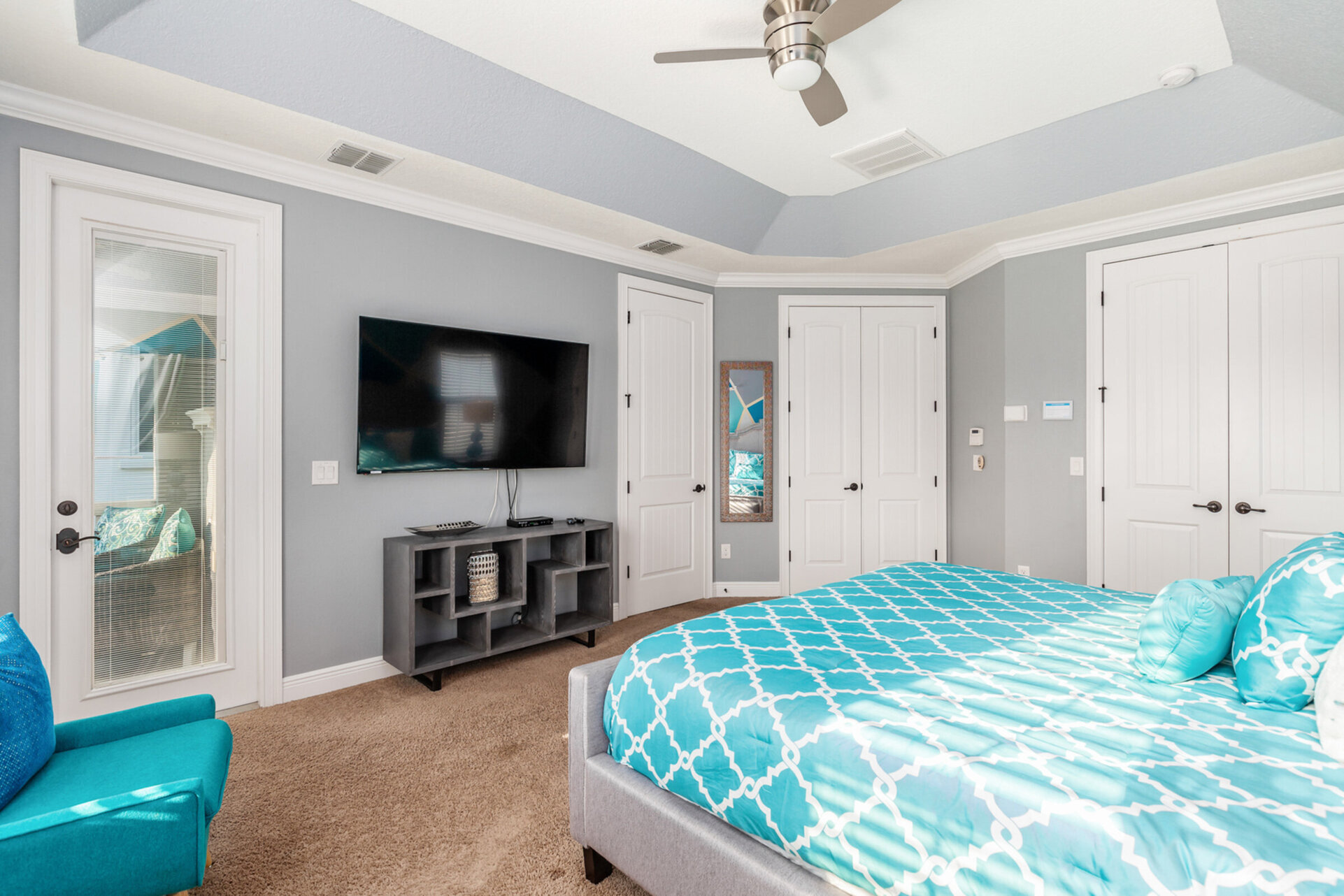 It features a king size bed, 65-Inch SMART TV, en-suite bathroom, and access to a balcony