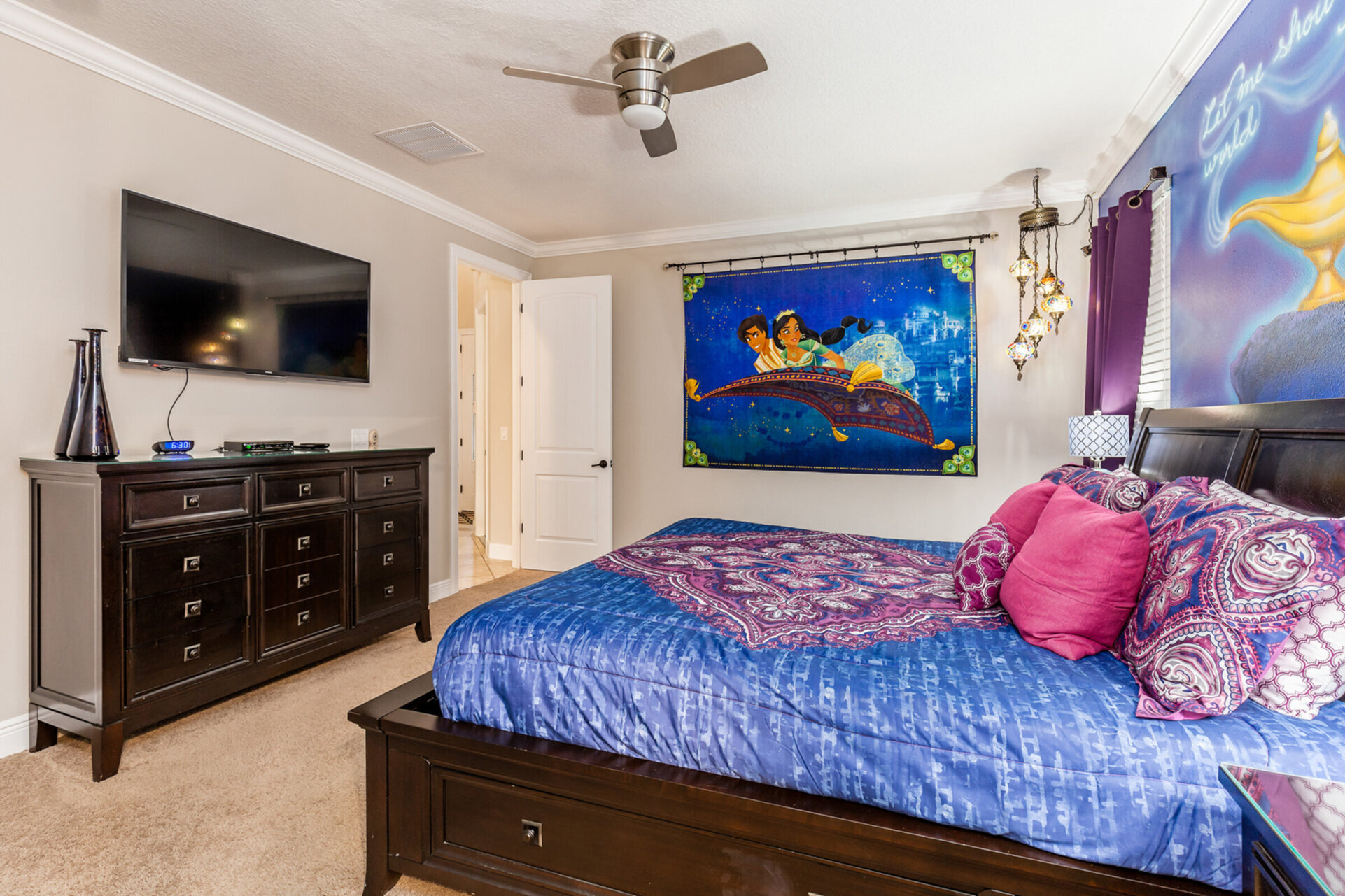 The master suite features a king bed, en-suite bathroom, and a SMART TV