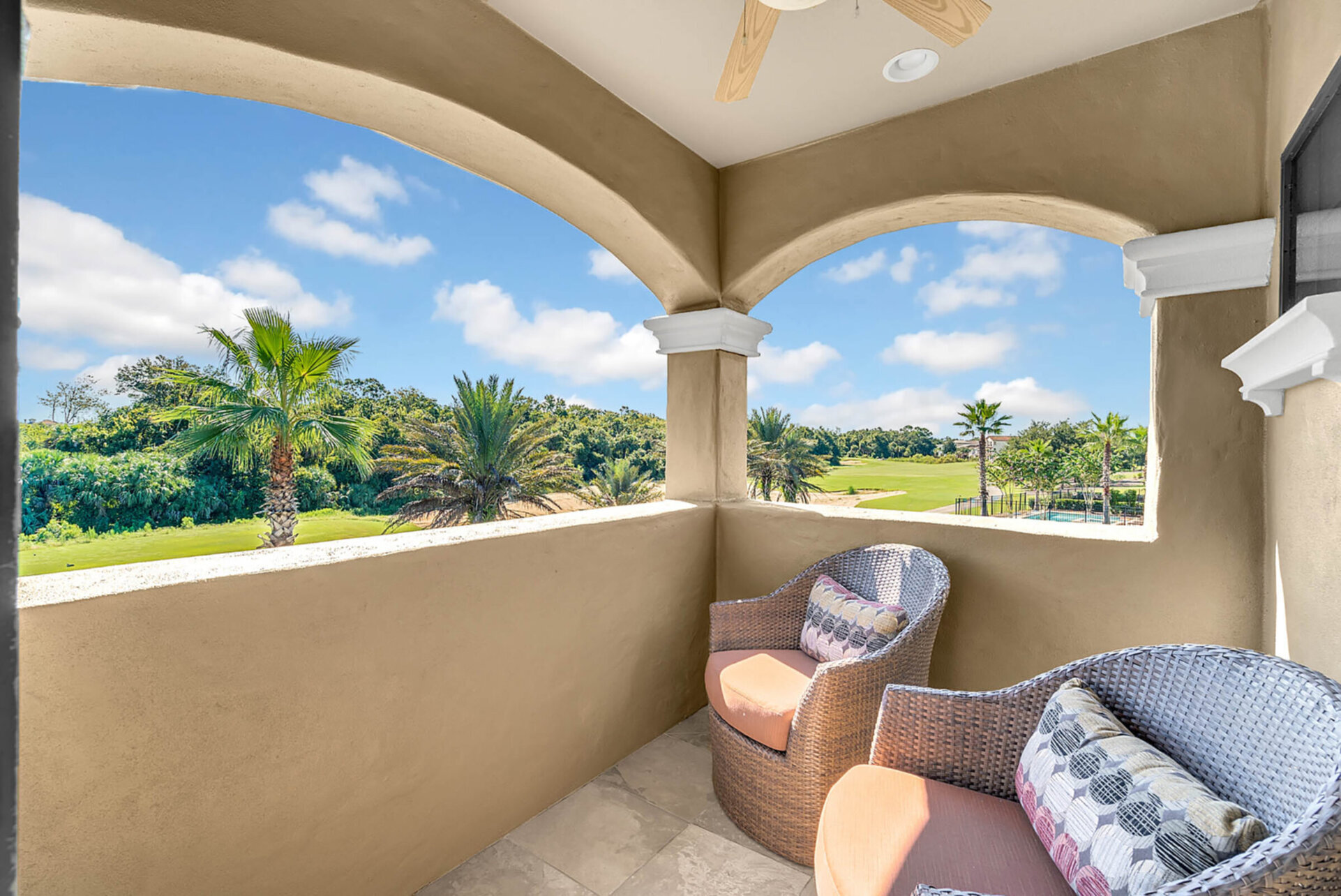 The second floor balcony features amazing views and comfortable patio furniture