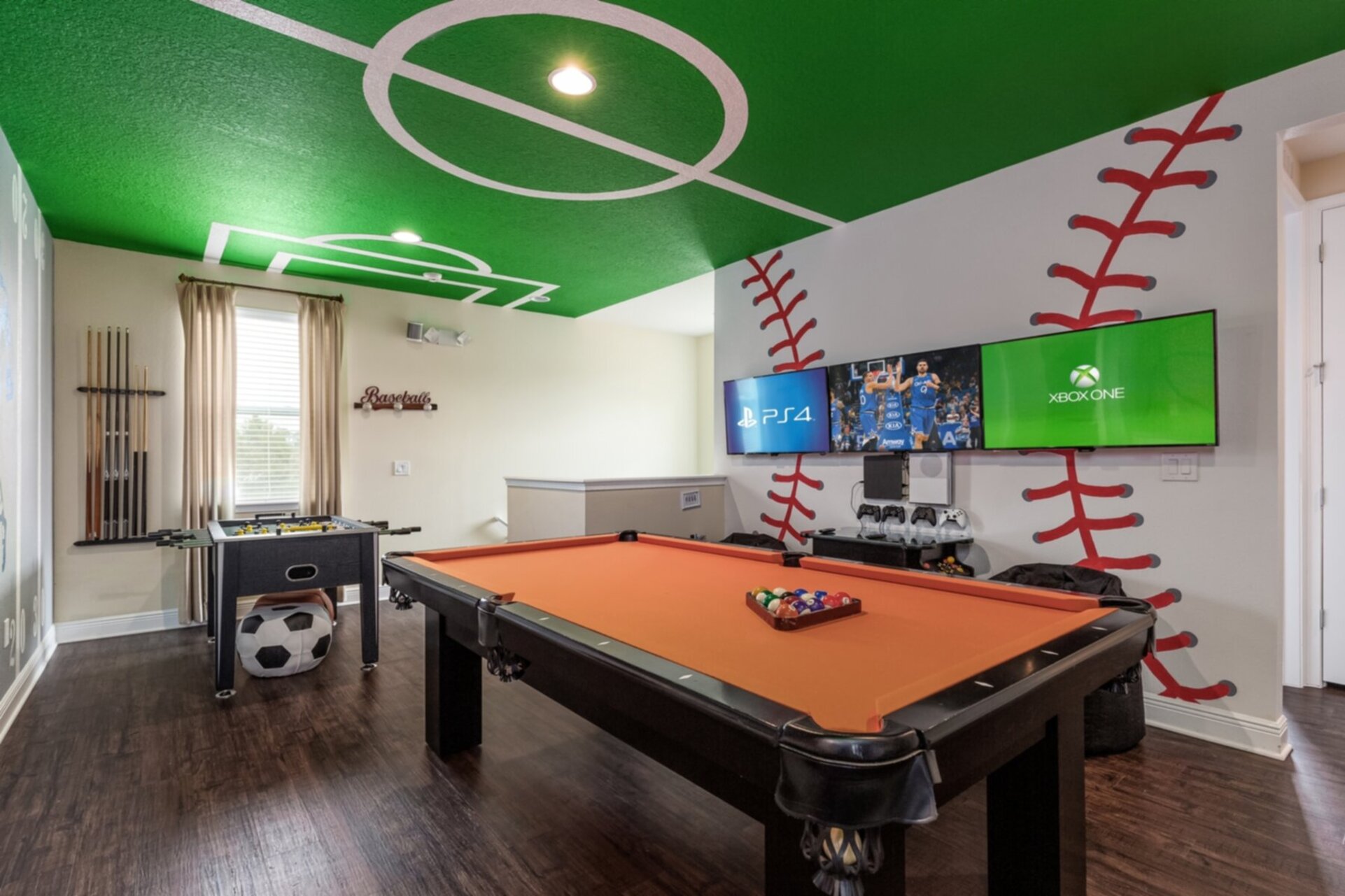 3 43-inch SMART TVs are on the wall connected to a PS4 and Xbox One S