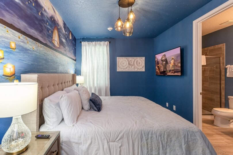 This gorgeous king bedroom features a custom floating lantern mural