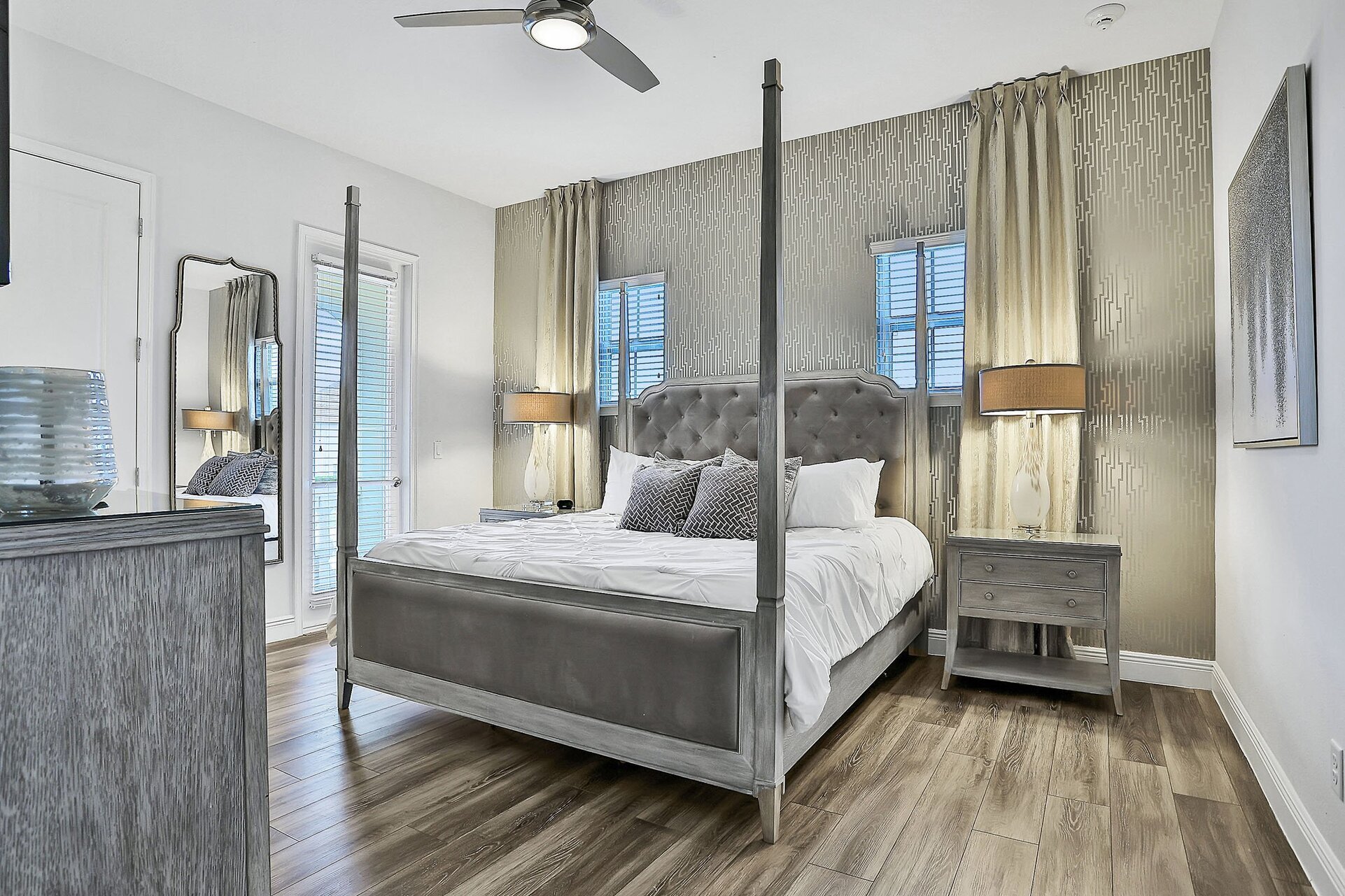 This master suite has a king bed and private access to the second-floor balcony
