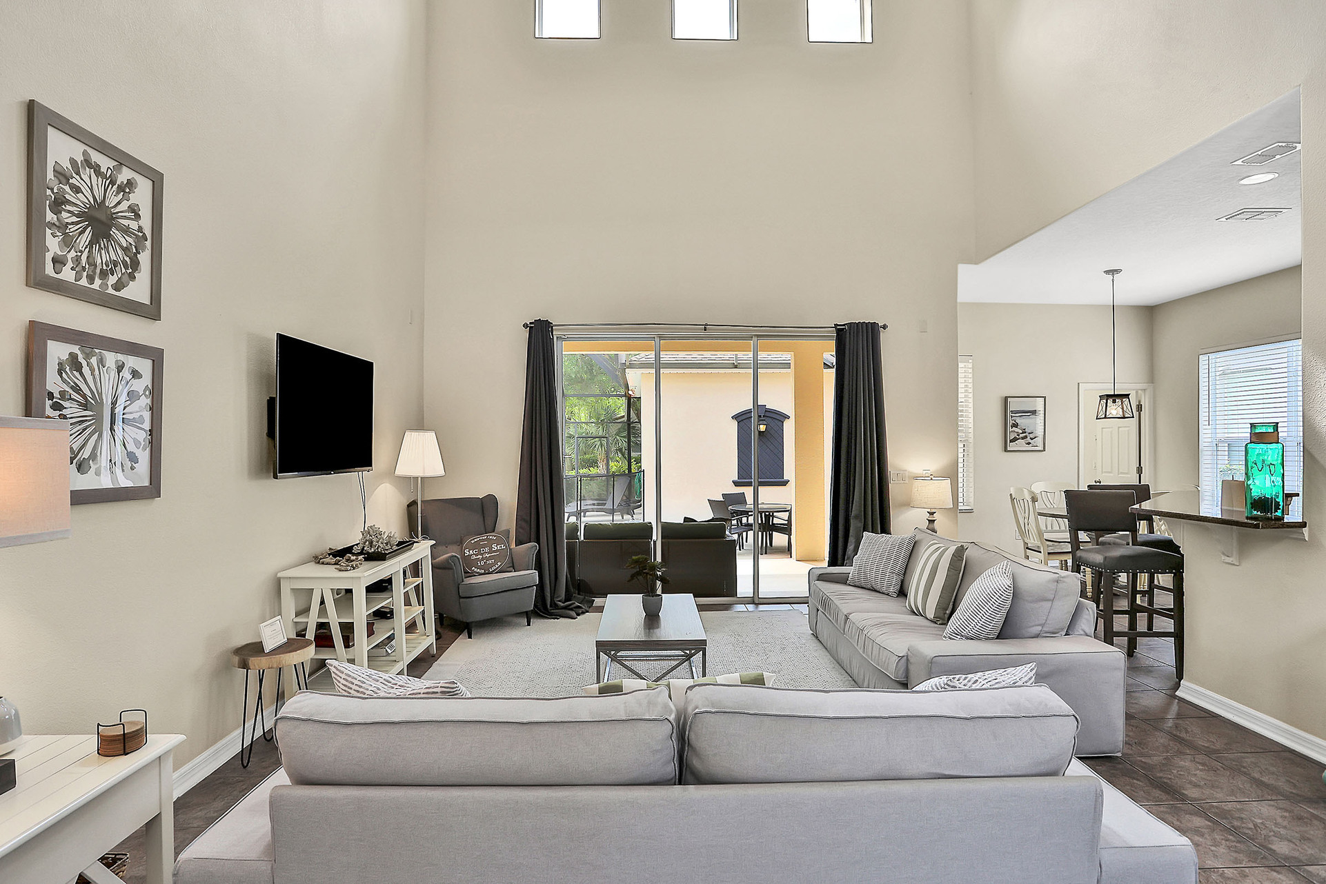 The living area leads right to the patio and has plenty of space for the whole family to gather together