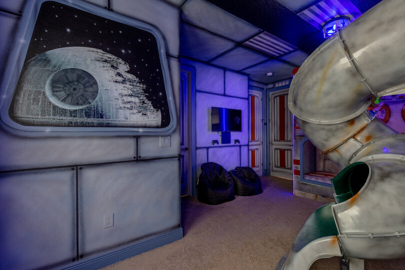 Kids will love the gaming area with beanbag chairs and TV