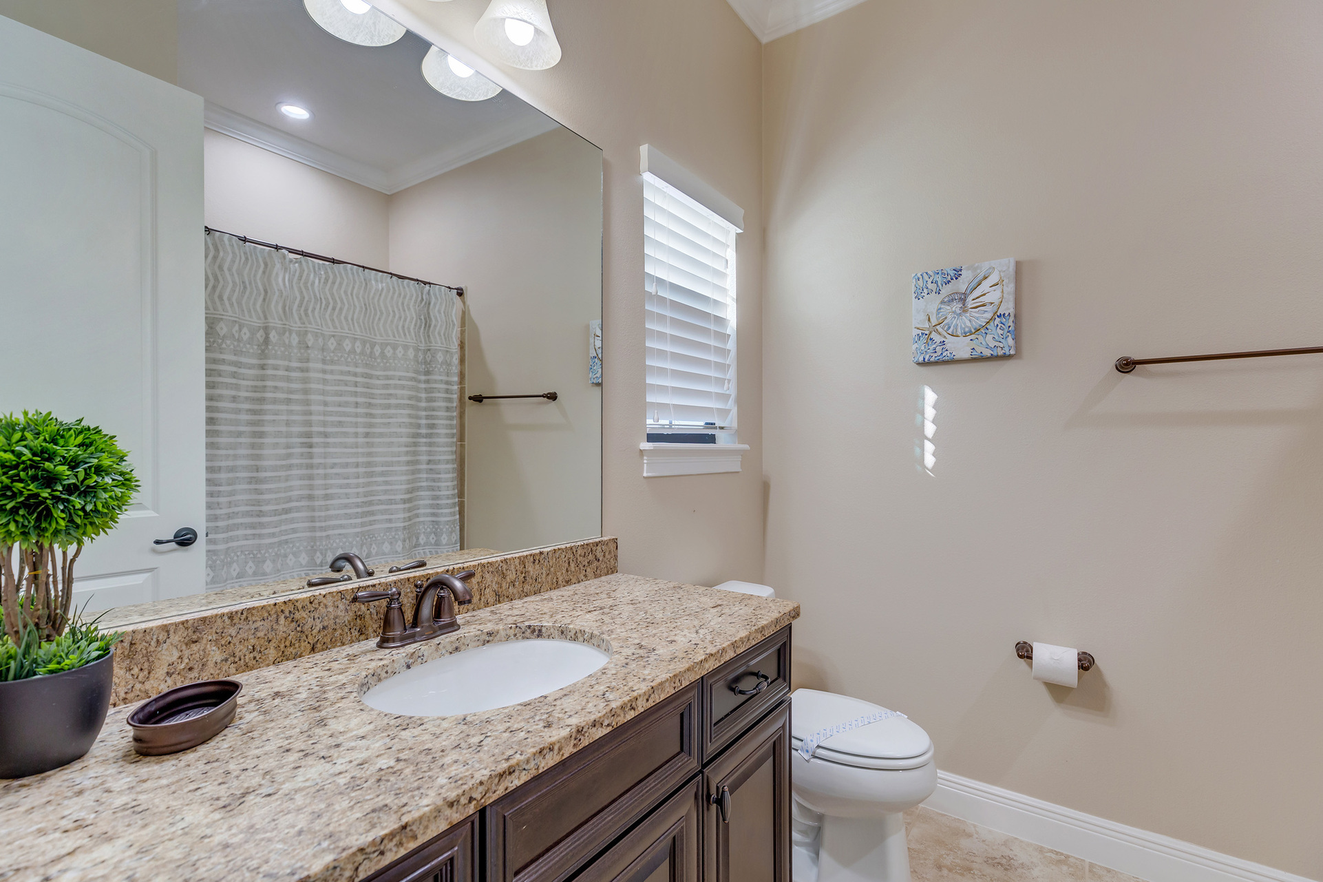 The en-suite bathroom includes a combo tub/shower