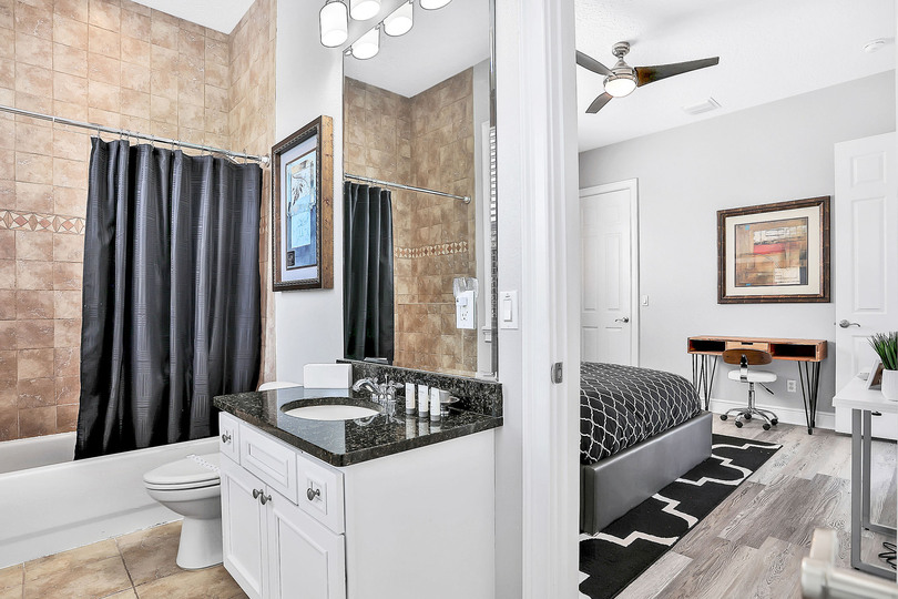 Shared en suite bathroom with combined tub shower
