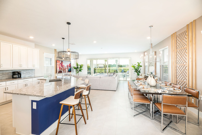 Step inside to the large open concept living area with modern, coastal-style furnishings