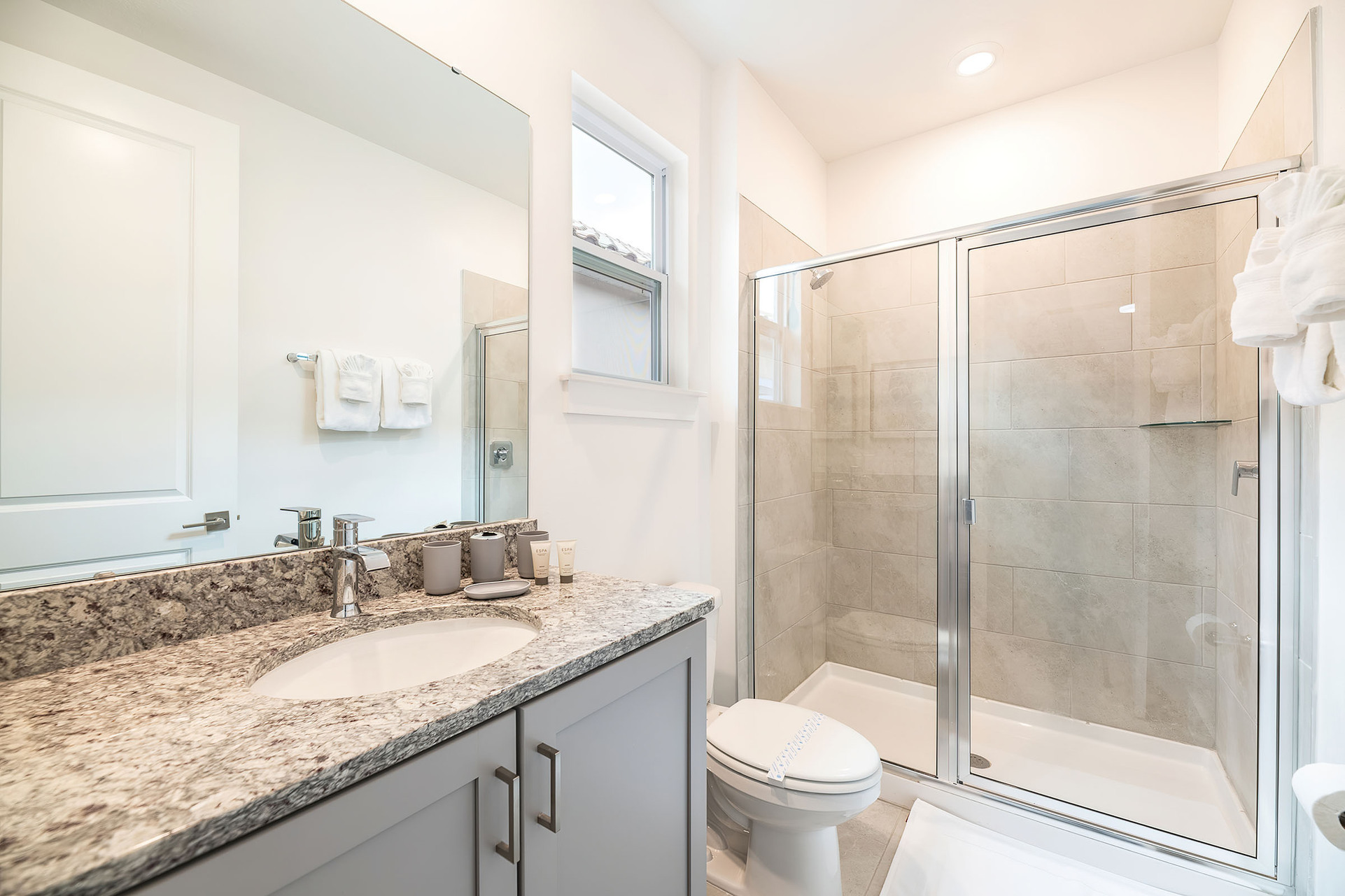 The en suite bathroom includes a walk-in shower