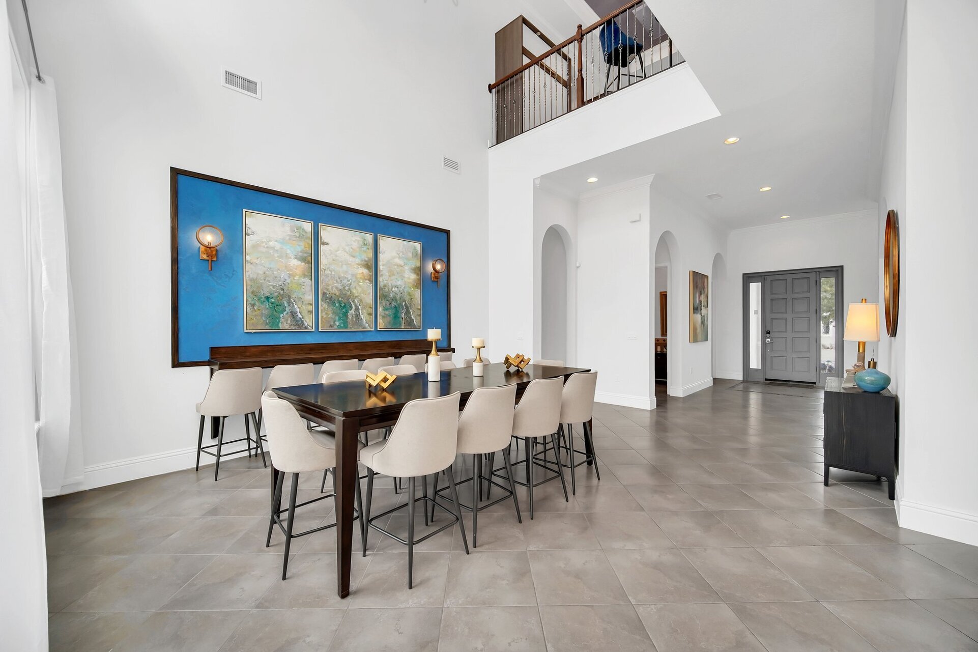 Elevate your dining experience in this stunning space with high ceilings and abundant natural light streaming through expansive glass walls.