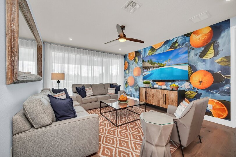 Gather in the 2nd floor loft area, a versatile space perfect for lounging, watching movies, or enjoying casual conversations