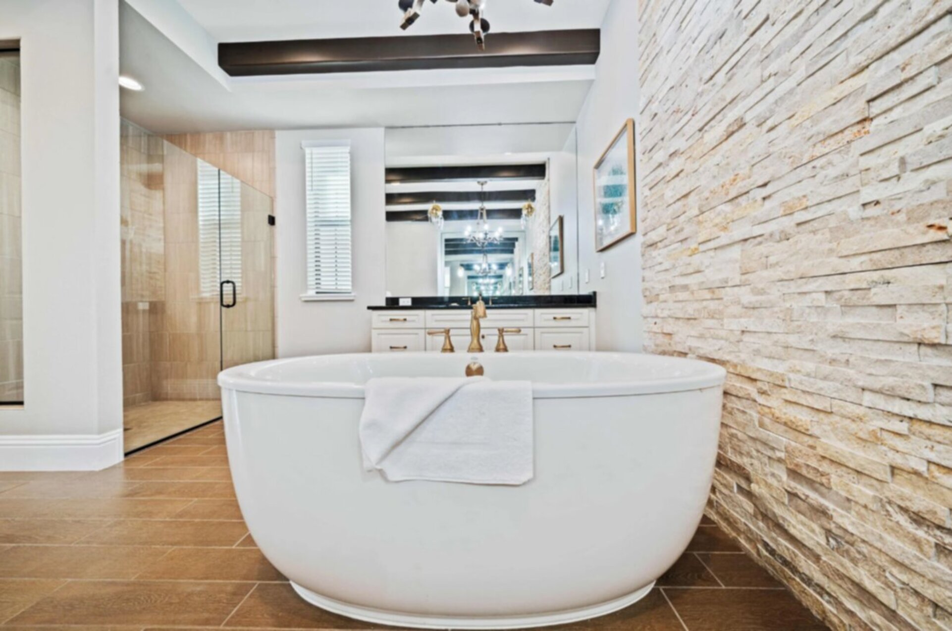 En-suite bathroom with large soaking tub and glass door walk-in shower