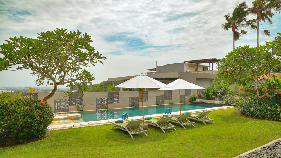 Tranquil lawn and pool area