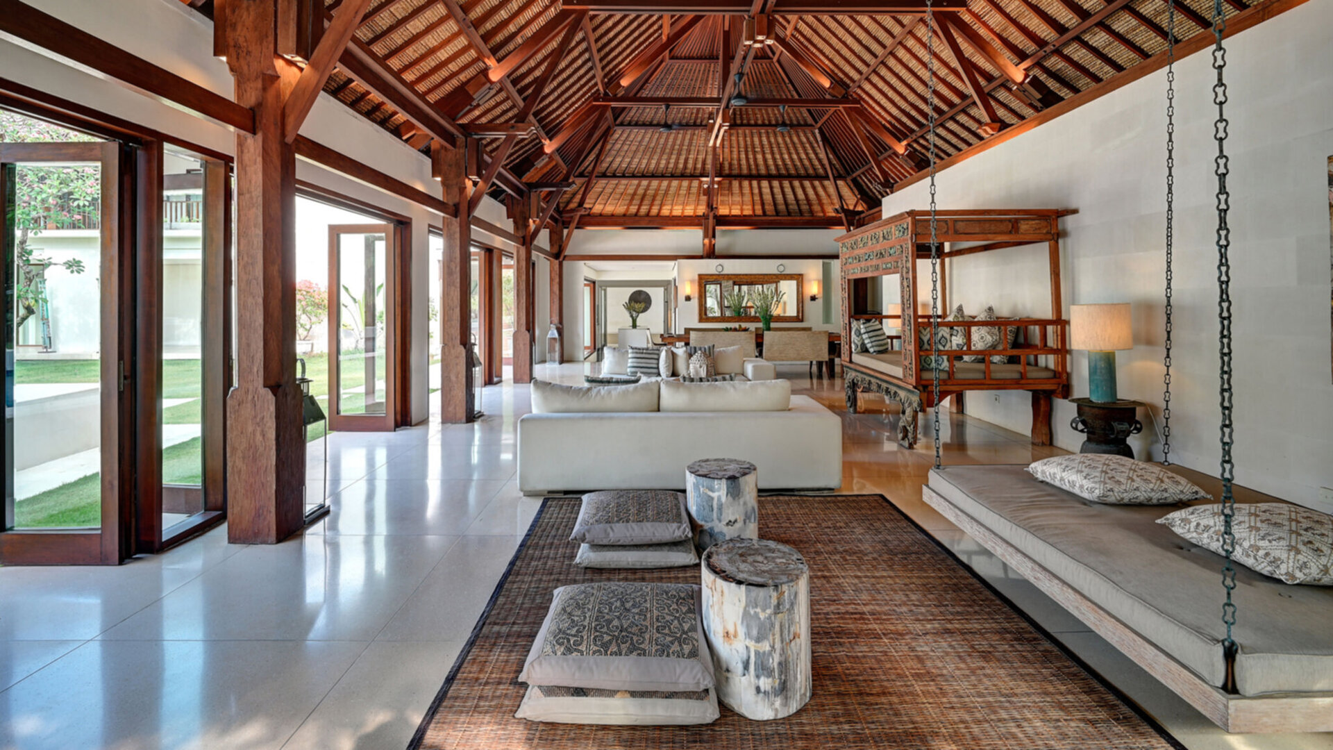 Relaxing living and dining pavilion by the pool area and lawn