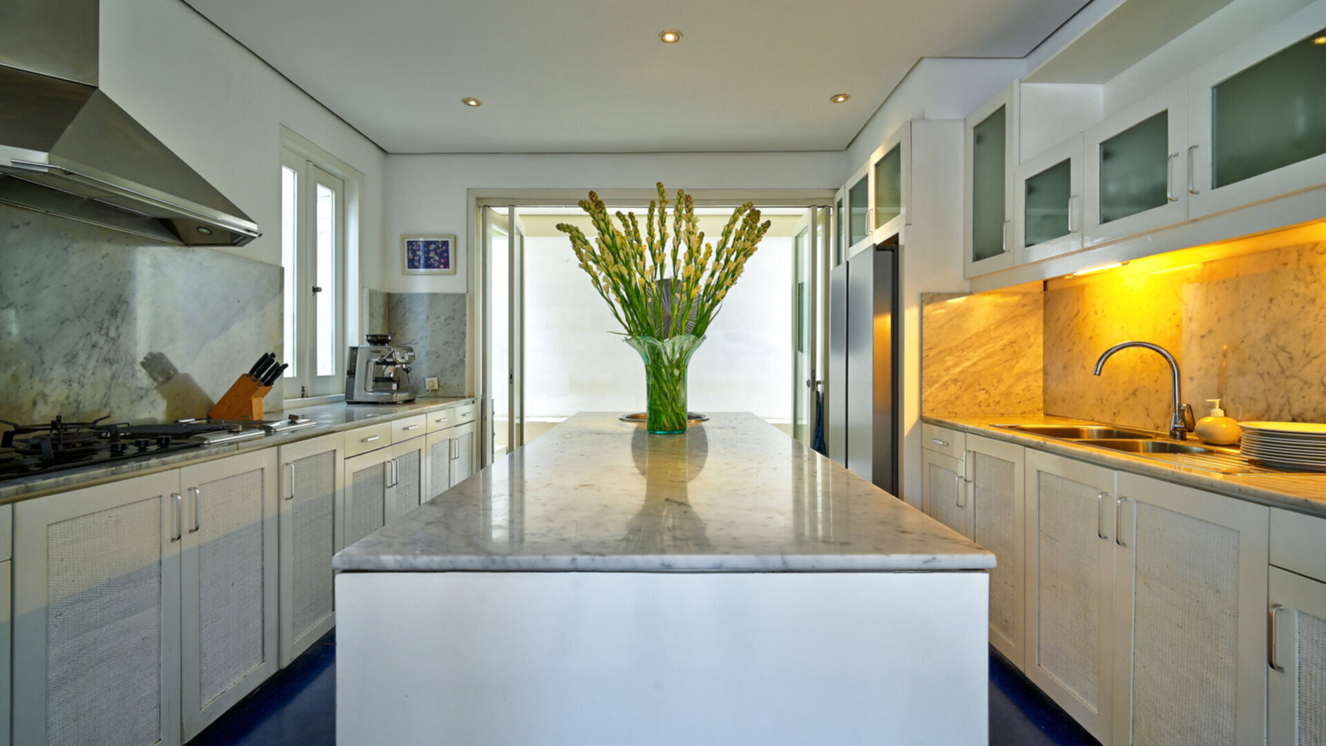 Dining area overlooking the pool and lawn