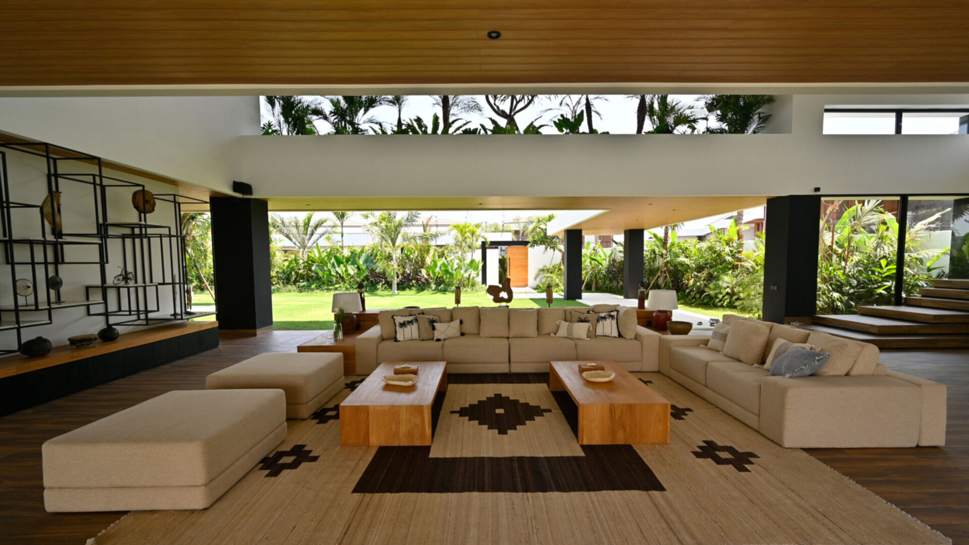 Expansive living area amidst the pool and lawn area