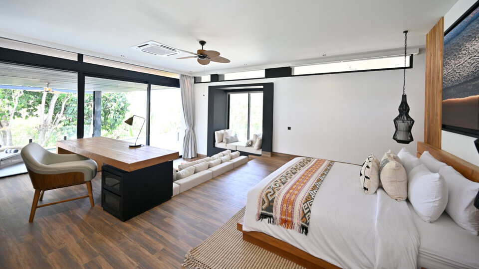 Plush master bedroom with a lounge and study