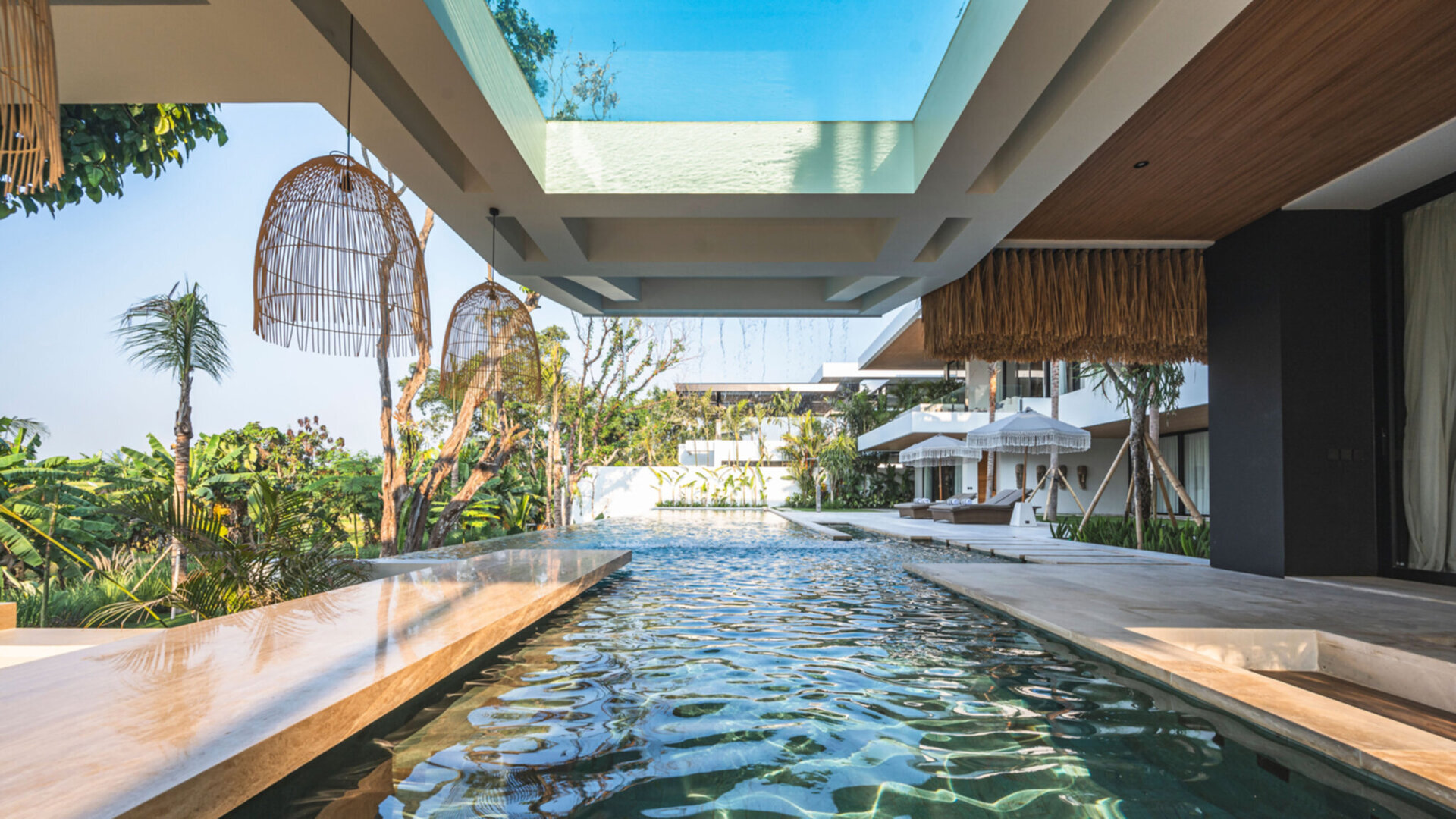 The expansive saltwater pool extends the width of the property