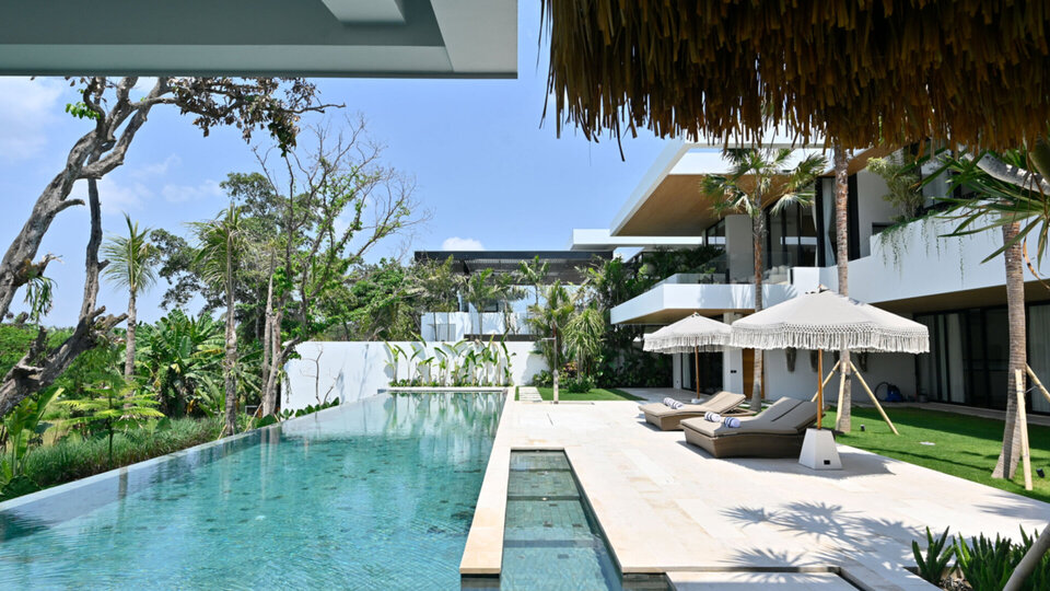 A captivating view of the pool deck from the sunken outdoor sala