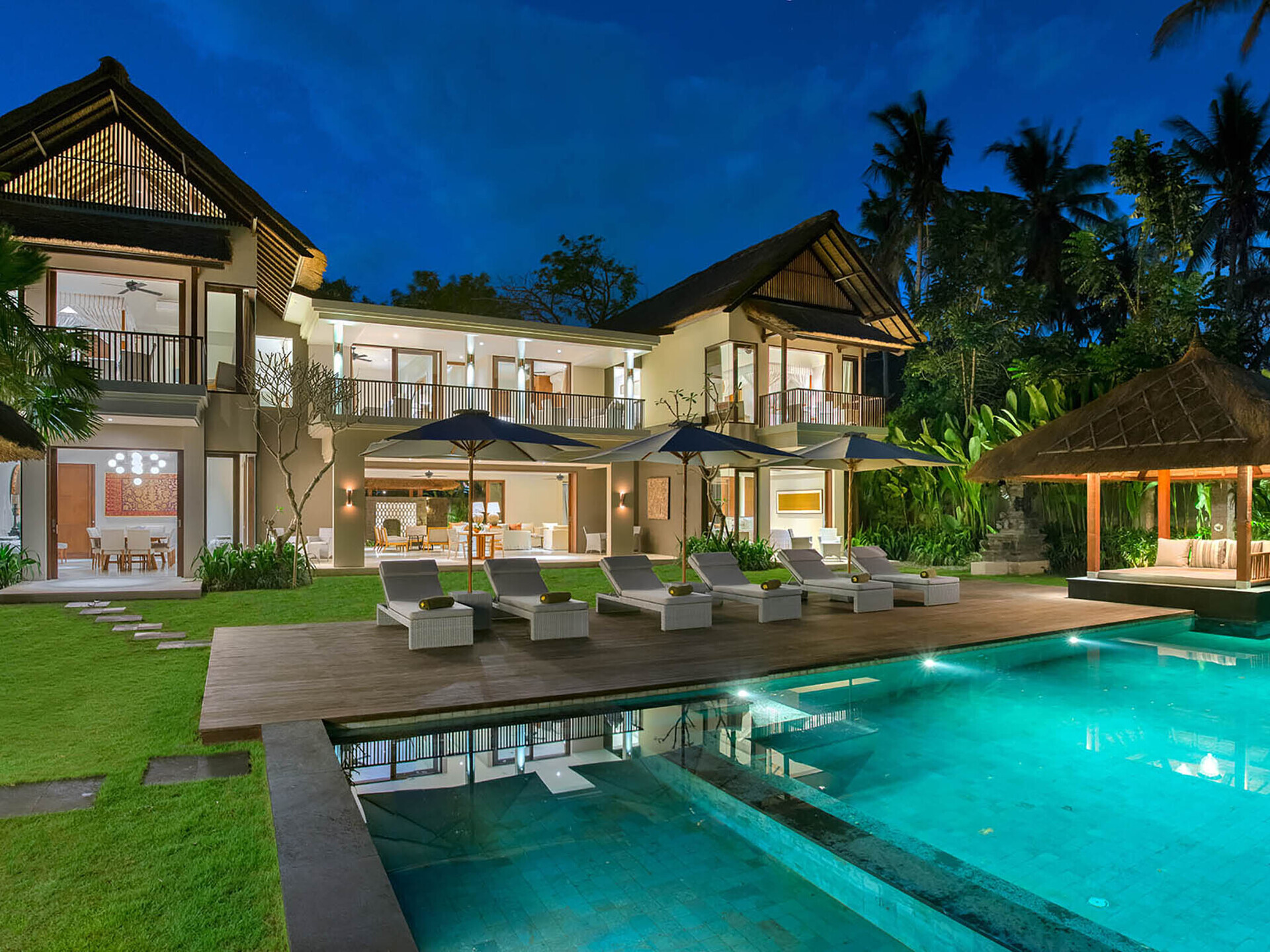 The villa lit up at night