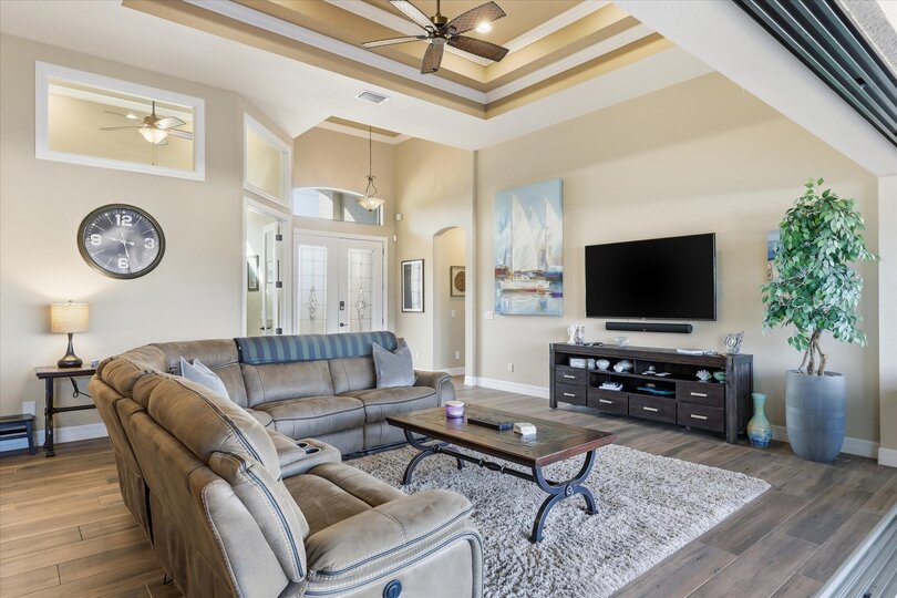 Living room with comfy seating and 70-inch Smart TV