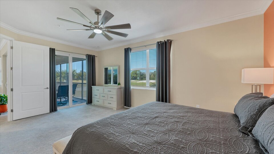 Primary bedroom with king bed and attached bathroom