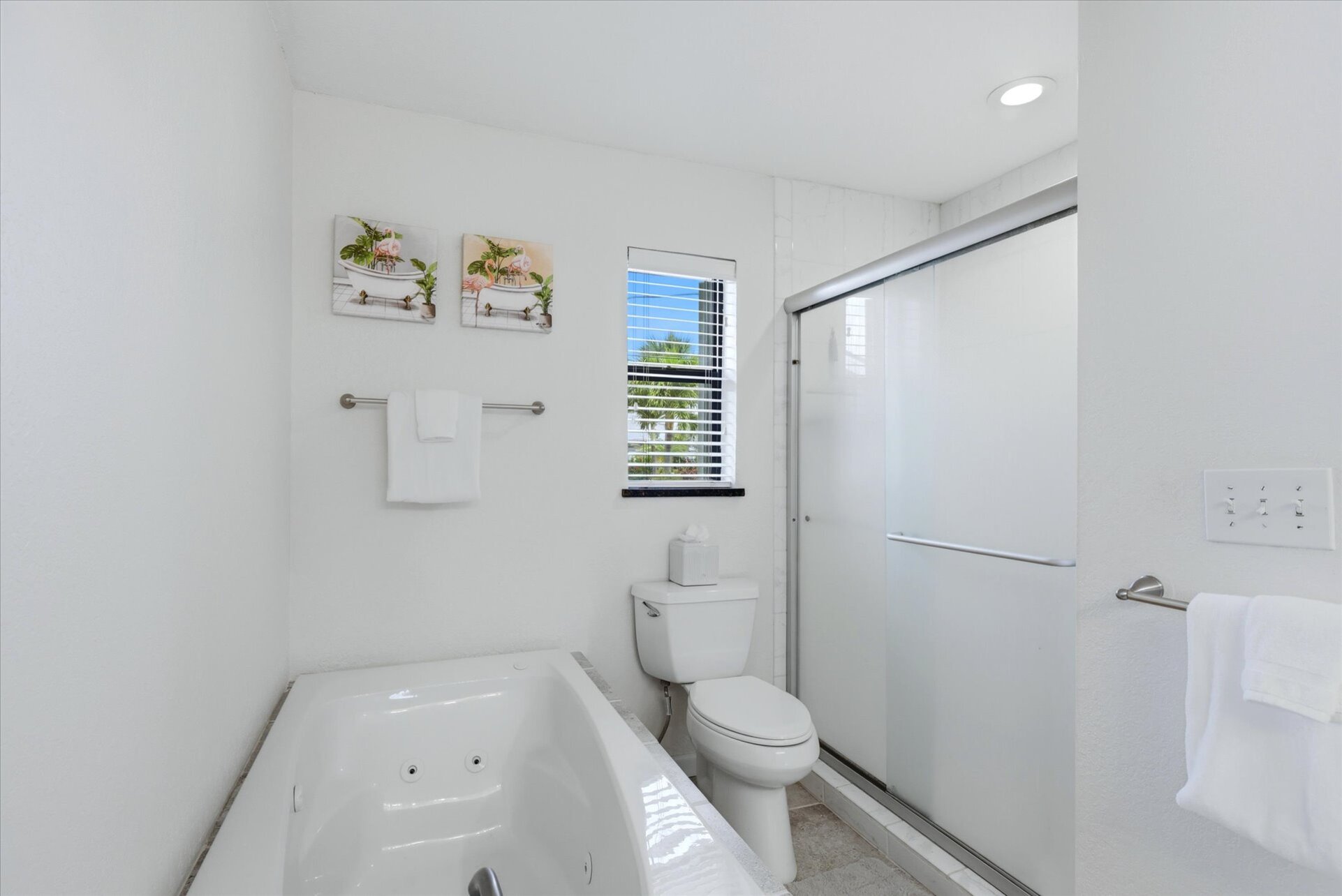 Primary bedroom attached bathroom with walk-in shower, soaking tub, and double vanities