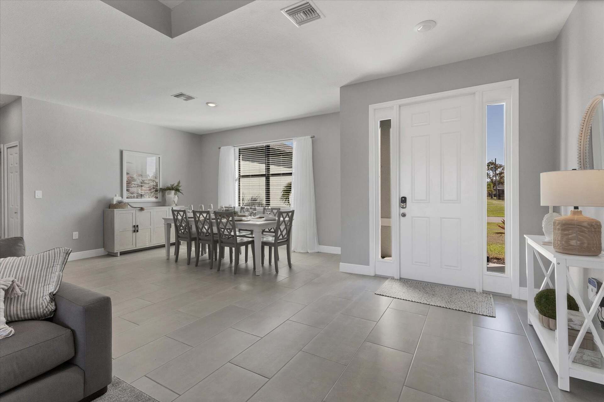 Beautiful, bright, open living area. Dining table seats 8