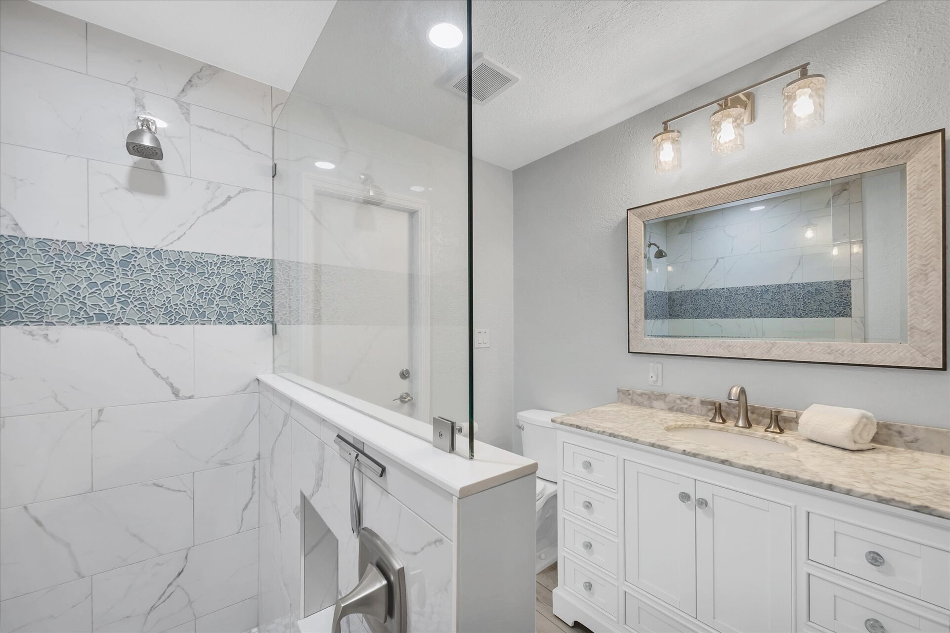 Guest bathroom featuring large walk-in shower