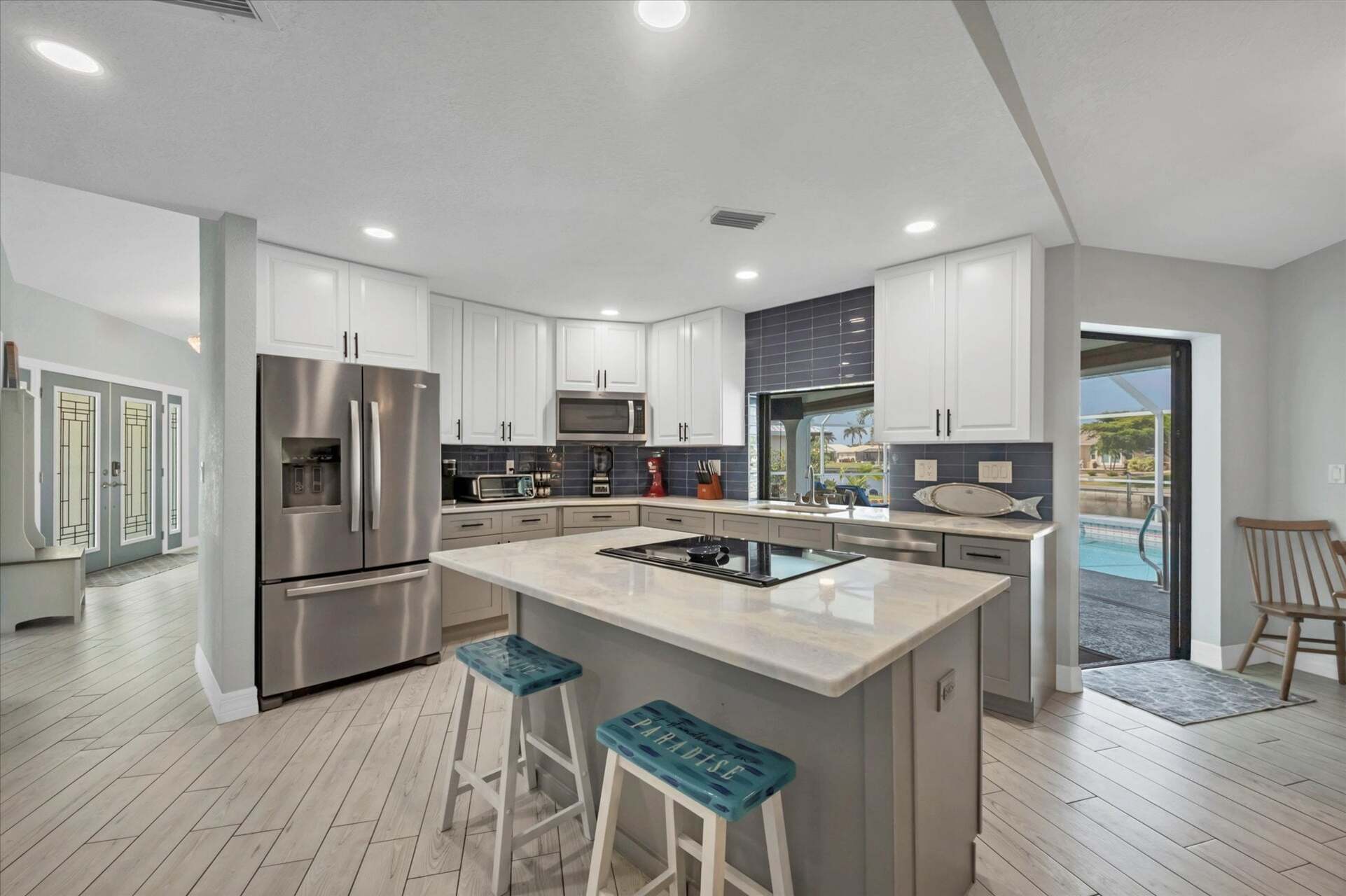 Beautiful, fully-equipped kitchen with new appliances. Kitchen island seats 2