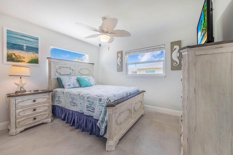 Bedroom 2 with queen bed and 39-inch Smart TV