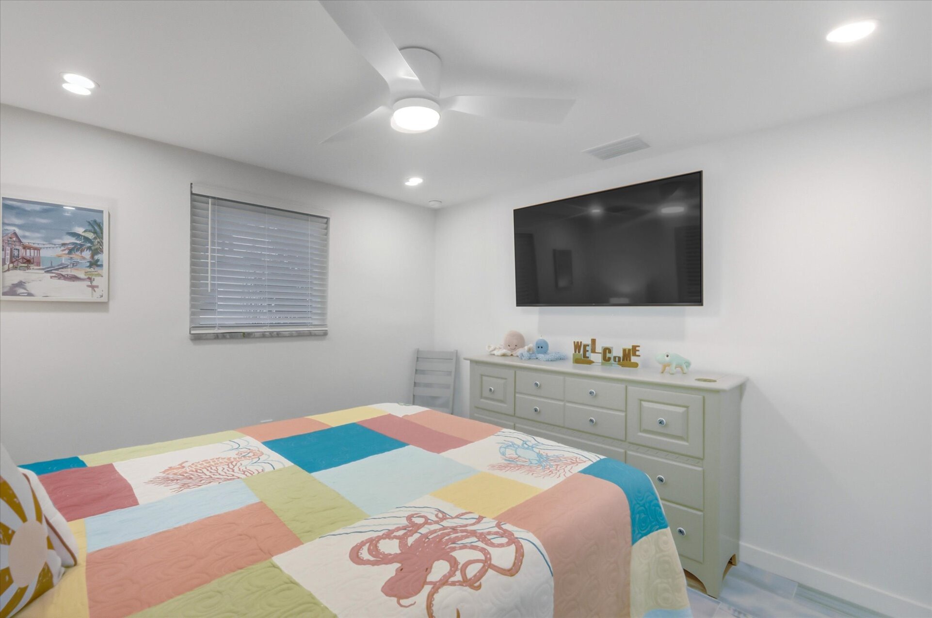 Bedroom 2 with queen bed and 55-inch Smart TV
