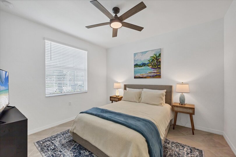 Bedroom #2 with queen bed and 50-inch Smart TV