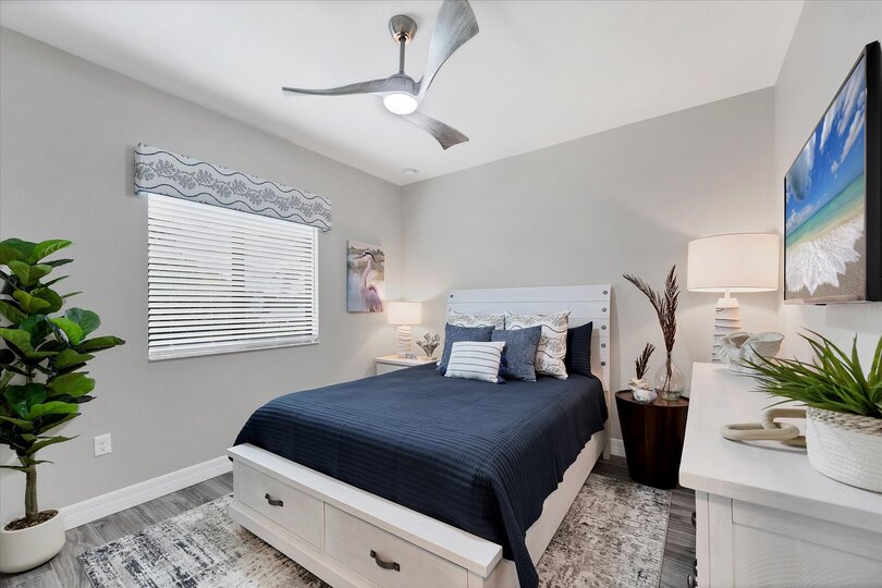 Guest bedroom 1 with a queen bed and 43-inch Smart TV