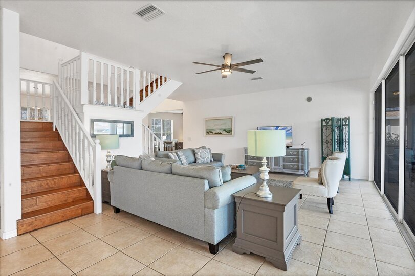 Beautiful, bright, open living space with fantastic view of the pool area and canal beyond. Living room also features a secret Harry Potter room under the staircase